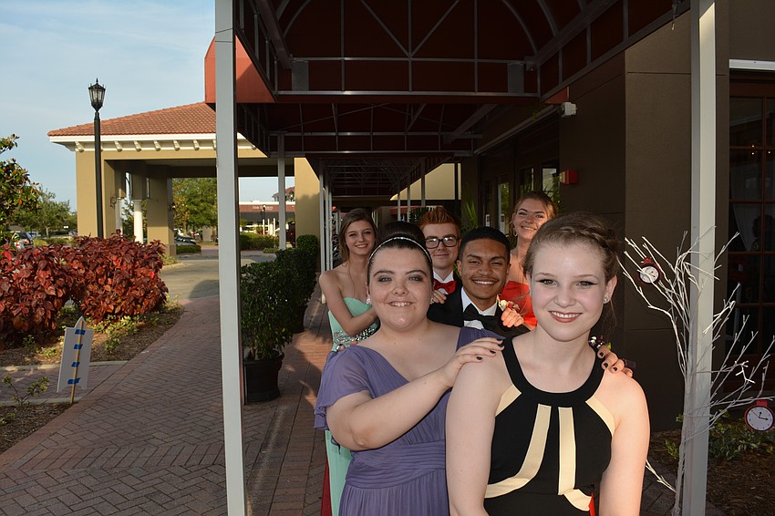 From front to back, Sophia Colosia, Kelsey Fiander-Carr, Victor Vargas, Jake Stonecypher, Erika Jessen and Ashley Williams have fun outside the Polo Grill.