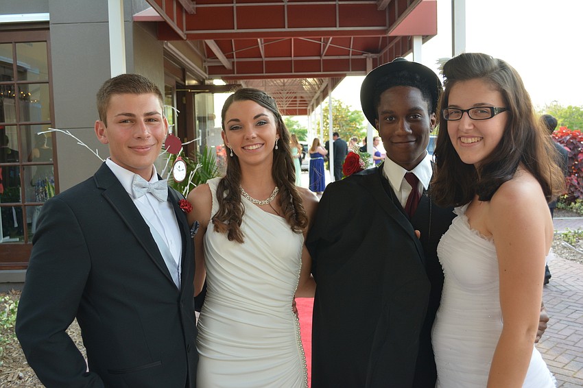 Seniors Jake Andrews and Carly McCarthy join graduate Trea Hall and junior Lexi Davis before the doors swing open.