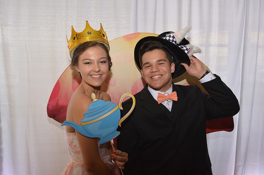 Juniors Jenna Padgett and Will Miller clown in front of a mushroom.