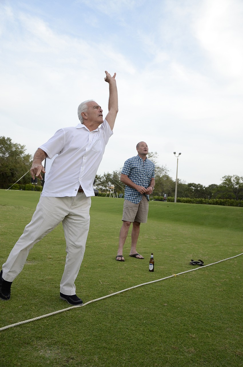 Bob Wolfe tries his hand at horseshoes.