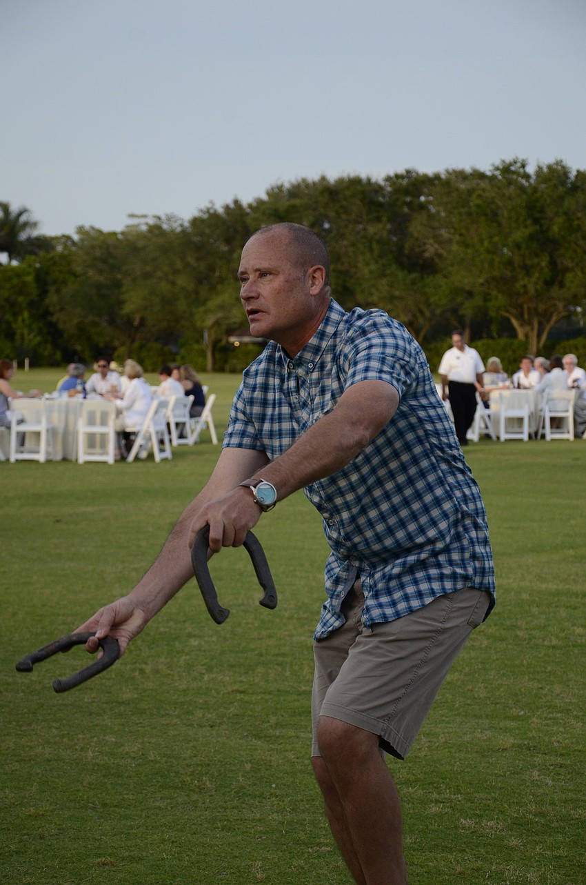 Brian Cleary perfects his pitch during a horseshoe contest.