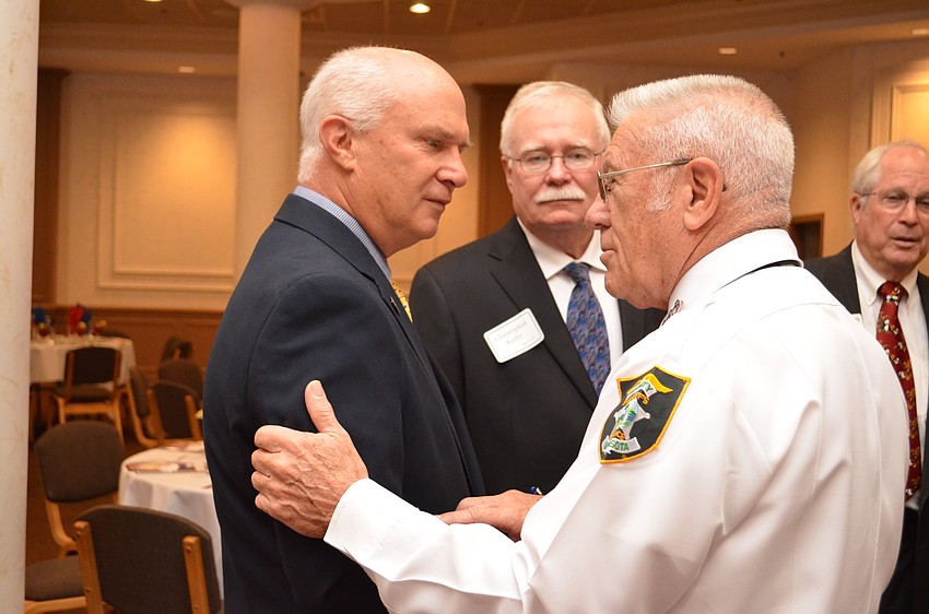 John M. Rosetrater and retired Army Col. Ben Knisely