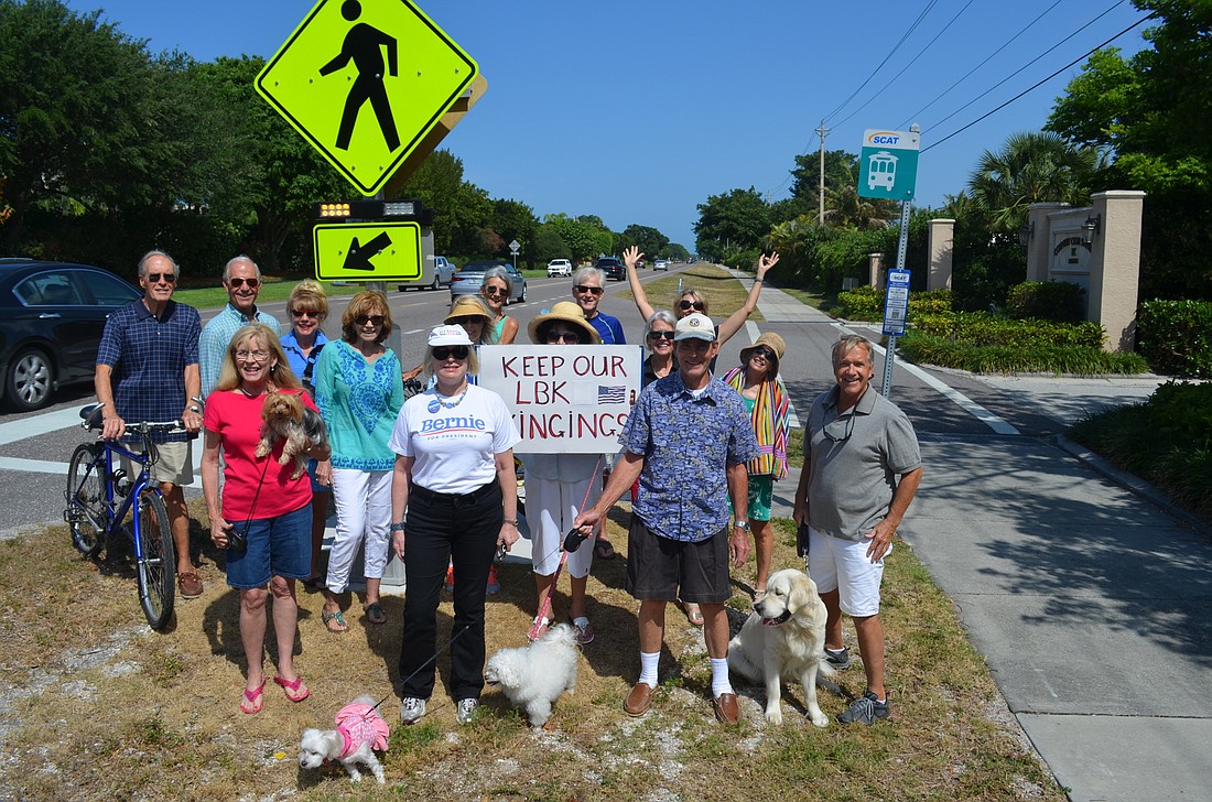 Country Club Shores residents, both human and canine, rally in support of their crosswalk.