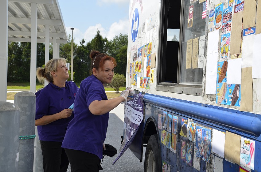 Lori McGregor and Evelyn Cotto discussed their options for a minute before making a selection.