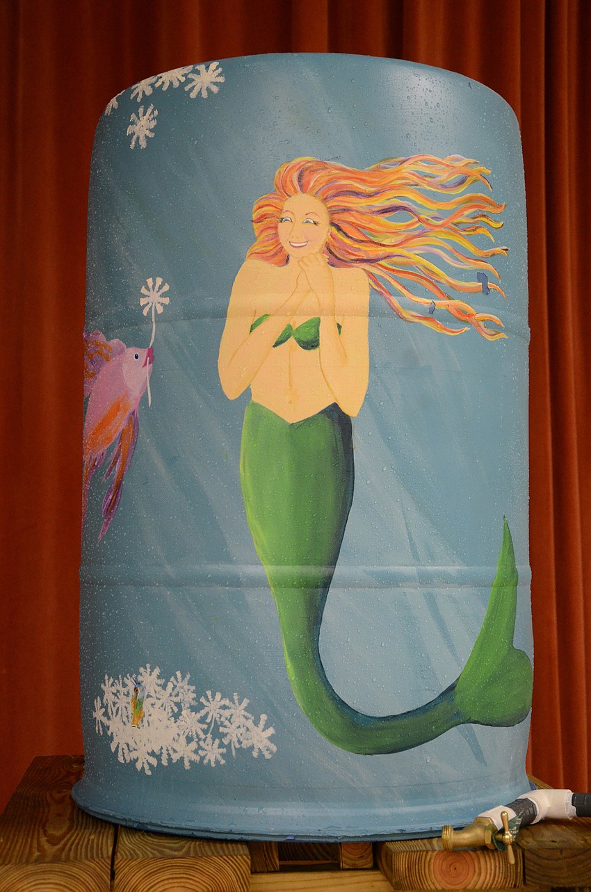 Gilbert W. McNeal Elementary won the state grand prize for its students' entries into the water conservation poster contest. Manatee County staff delivered the school's new rain barrel Wednesday.