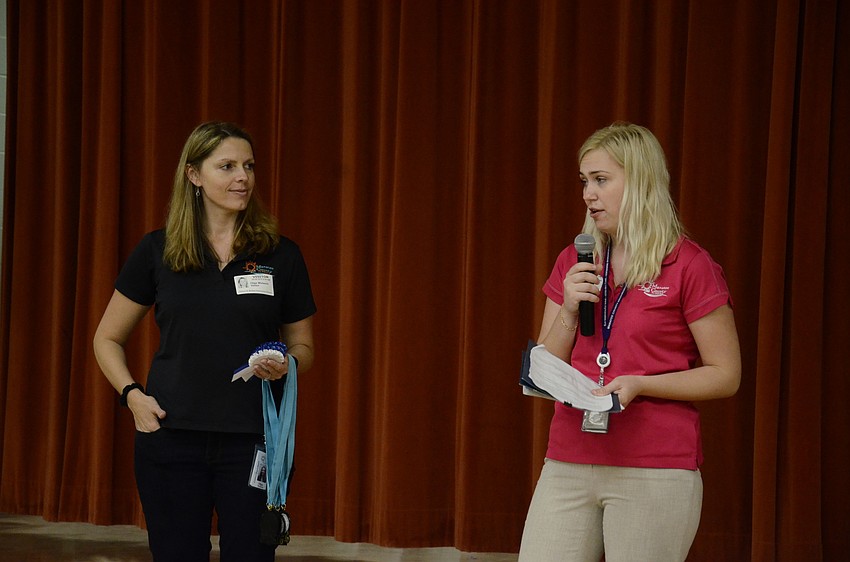 Olga Wolanin and Ingrida Barkauskaite with the Manatee County Utilities Department presented students with their water barrel and gave ribbons to state winners.