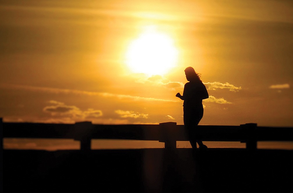 Paul Meese, of Longboat Key, captured this shot of a jogger near New Pass Bridge about an hour after sunrise.