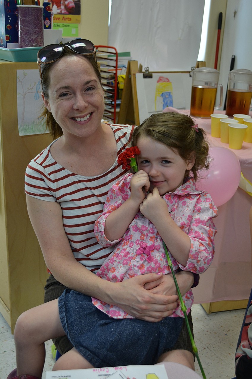 Angela Mahan spends tea time with her daughter, Caylin.