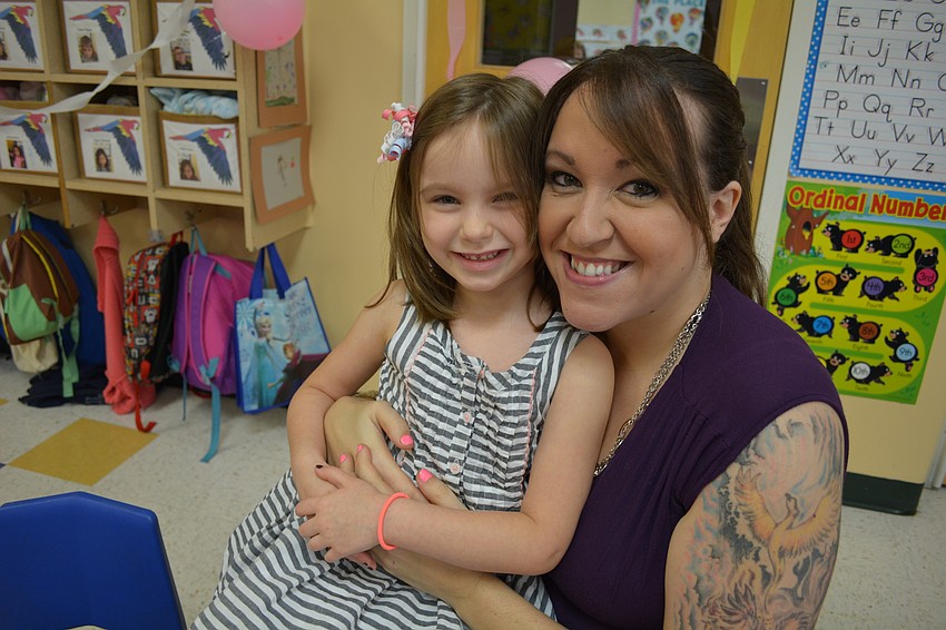 Aubrey Hoonhout-Jenkins, 5, eyes the snacks with her stepmom Tiffany Jenkins.
