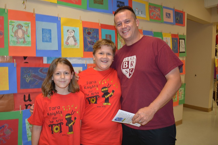 Marianne Schwartz, 10, joins her nephew Bobby Pike, also 10, and his dad, Jason Pike.