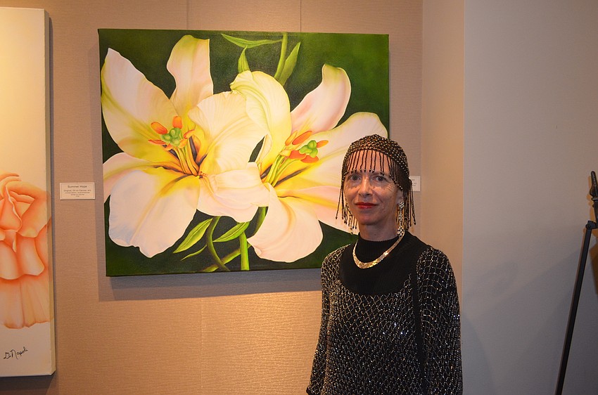 Artist Renee DiNapoli with “Lilies in Motion”