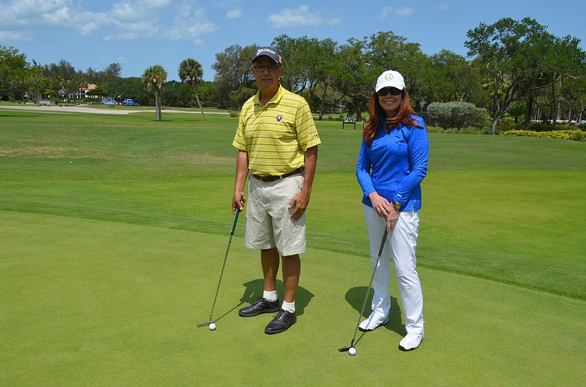 Bob Morelli and Sandra Nesbit participate in the putt-putt tournament.