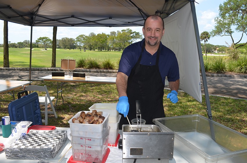 Jesse Johnson, of Station 400, makes the restaurant’s Waffled Sausage