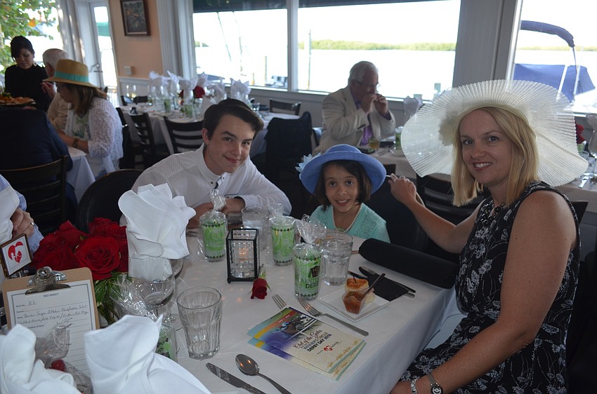 Rider of the Year Emma Howey, 10, center, with Jonathan and Jennifer Howey