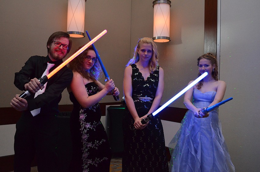 Caleb Pryor, Cyanne Doyle, Gabrielle Nutter and Olivia Neal duel with lightsabers during the 