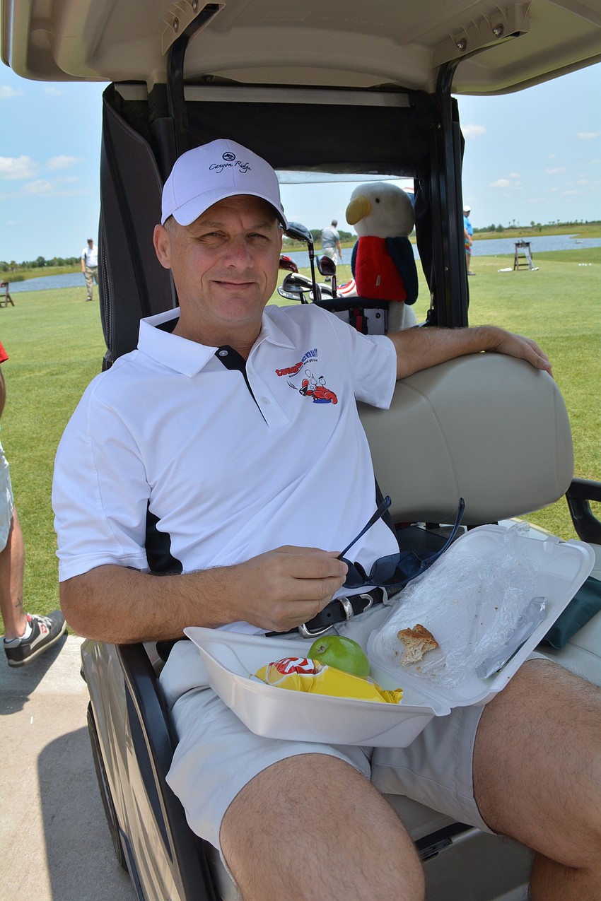Tim Hall enjoys lunch before the shotgun start.