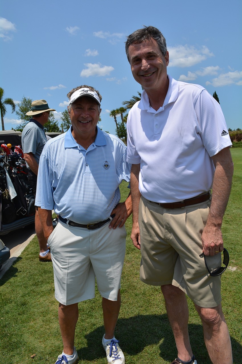 George Brusco, of Casto Realty, and Rick Ellis, of Dewberry, enjoy the nice weather.