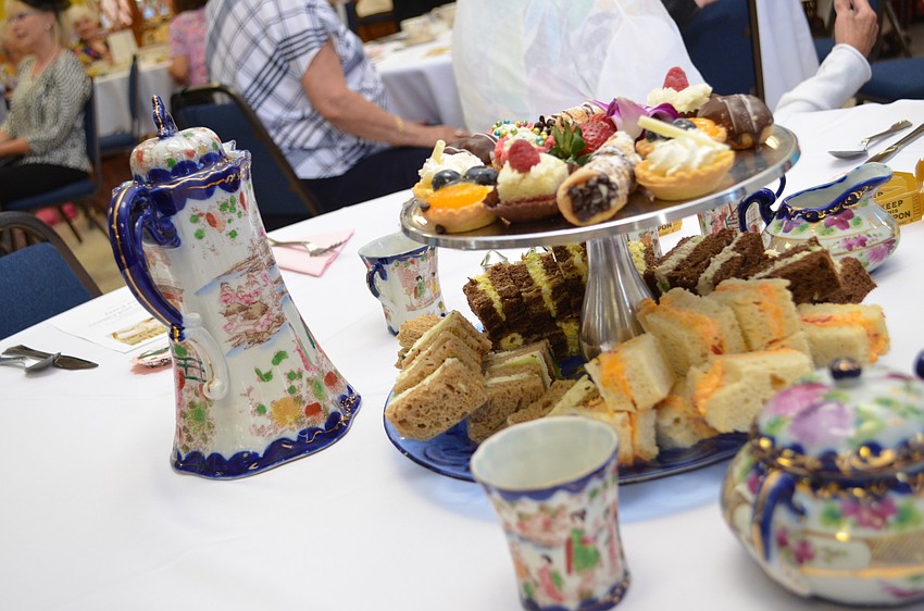 Each of the tables had tea, petit fours and sandwiches.