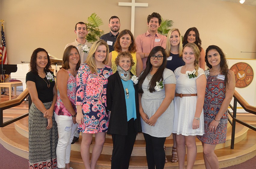 Scholarship coordinator Nathalie Treonis, front row center, with the scholarship recipients