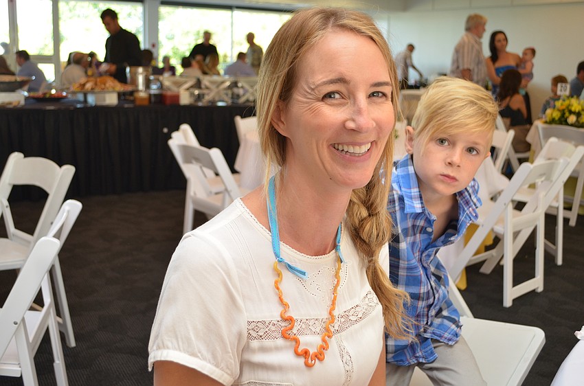 Liz Sandberg wears a macaroni necklace that her son Cale made for her two years ago.