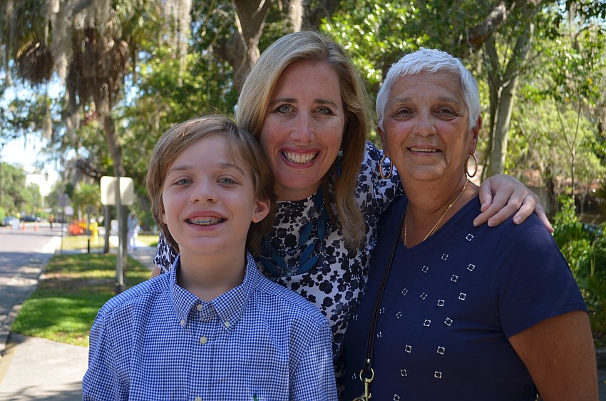 Marie Selby Botanical Gardens President and CEO Jennifer Rominiecki (center) with her son Luke and mother-in-law Dee Rominiecki.