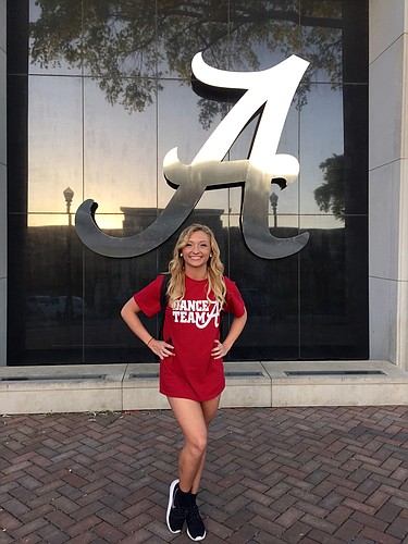 After earning a spot on the Crimson Cabaret dance team, Alexsa Dietrich shows off her new university colors.