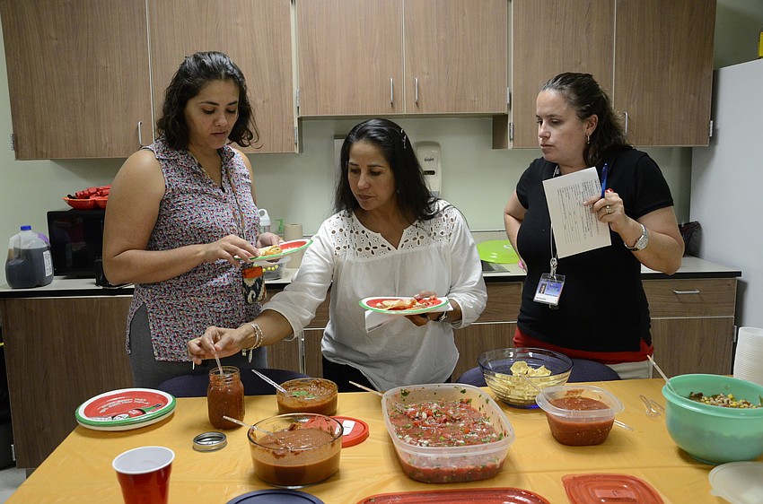 Gisela Lopez, Myrna Flores and Brittani Barnes discuss each salsa and tried to come to a conclusion.