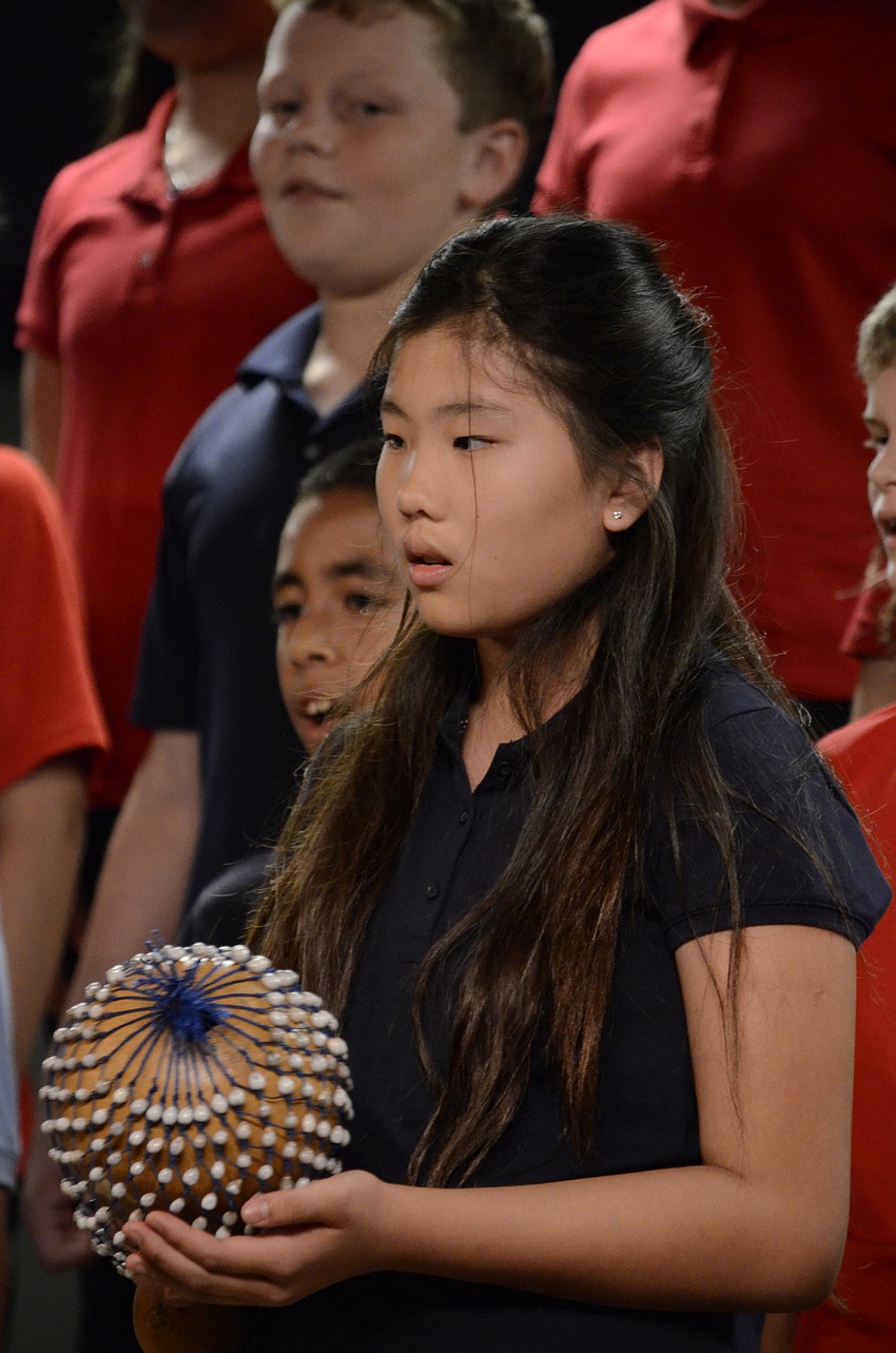 Hope Tudor shakes a shekere.