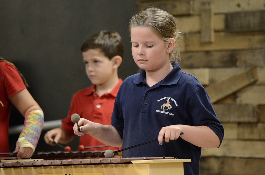 Shannon Boyce taps an alto xylaphone.
