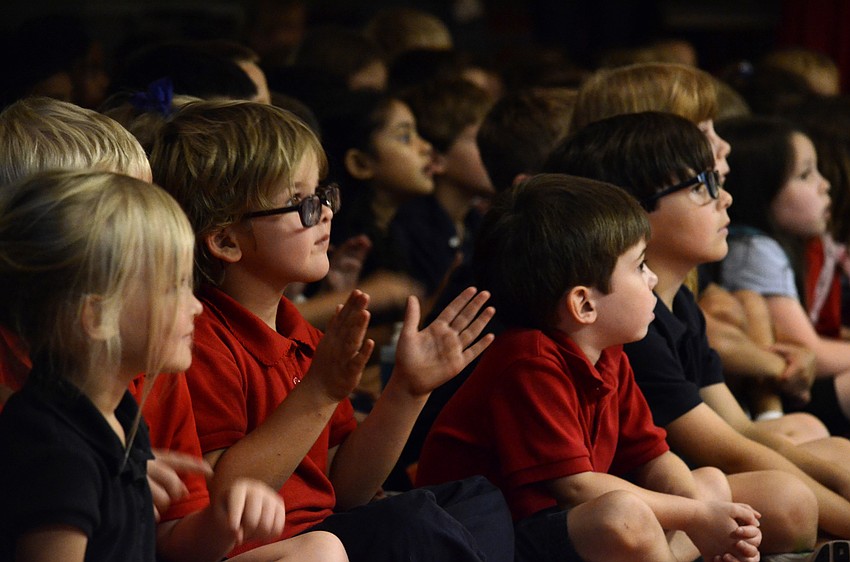 Khole Lovett gets into the music and claps along.