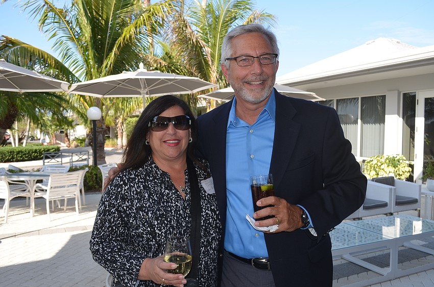Yvonne Schloss, of Sunglass Express Optical, and Sarasota Parking Manager Mark Lyons