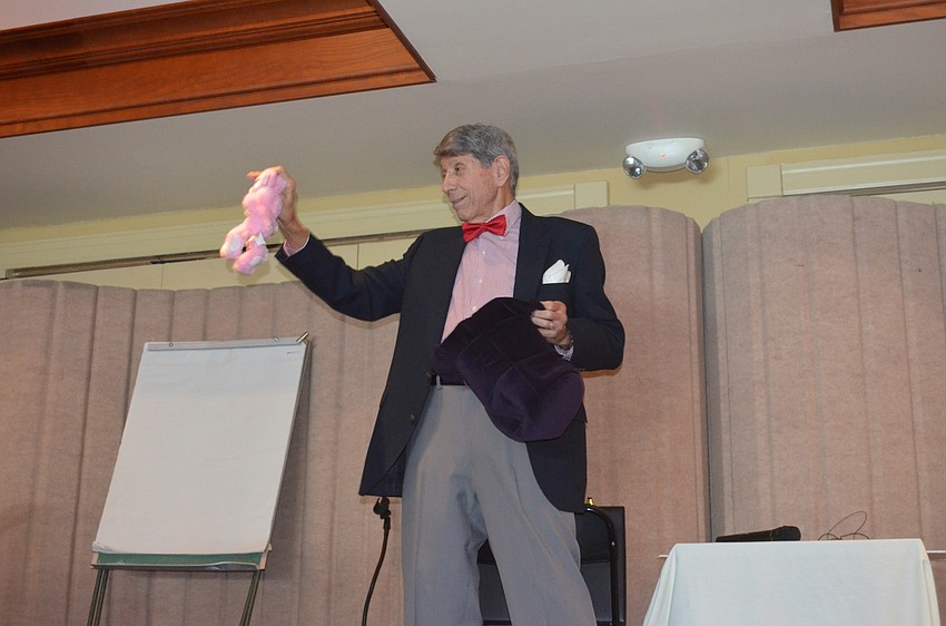 Arnie Kropf wows the audience with his magic.