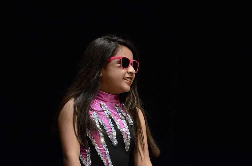 Tara fifth-grader Ashley Cruz dances to La Da Dee with two other Tara dancers.