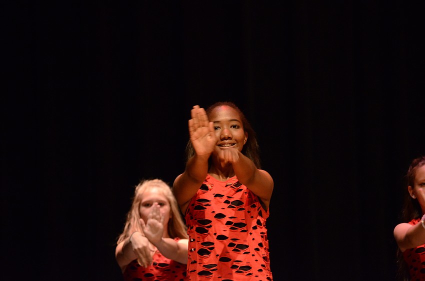 Braden River Middle School dance captain Reina Langley leads her teammates in a band routine.
