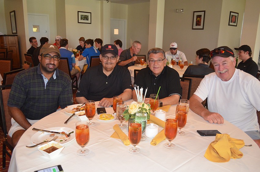 Felipe and John Colon, of Wells Fargo Advisors, Tom DeRita, of Place of Hope, and Laurie Gregan, of Preferred Parking Solutions