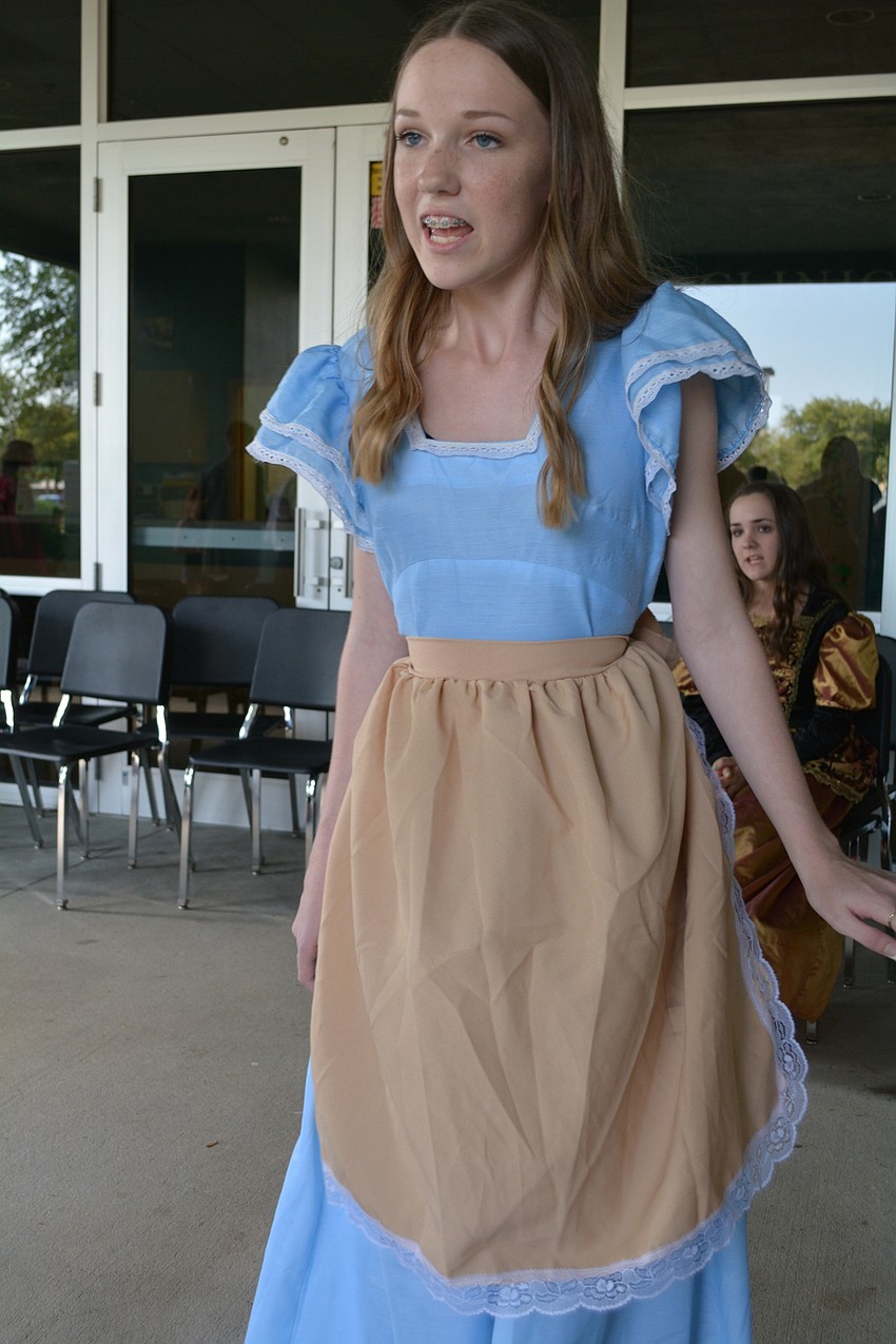 Nolan Middle School's Lily Adamson, as Cinderella, performs a scene from 