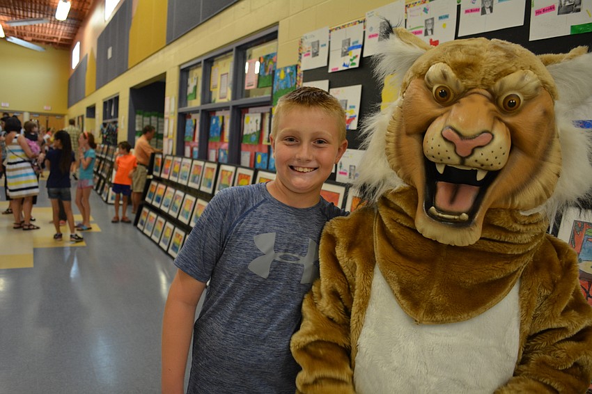 Gabe Klein, 10, meets up with the school mascot (friend Michael Kasper, also 10).