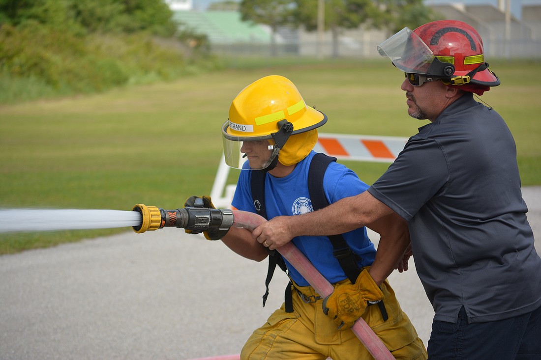 Manatee Technical student Dylan Strand receives a lesson from instructor Vic Accurso
