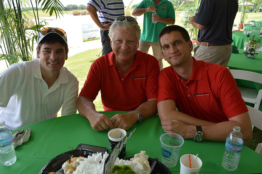 East County's Stu Henderson, of Fawley Bryant, eats with Willis Smith Construction's Kim French and Nathan Carr.