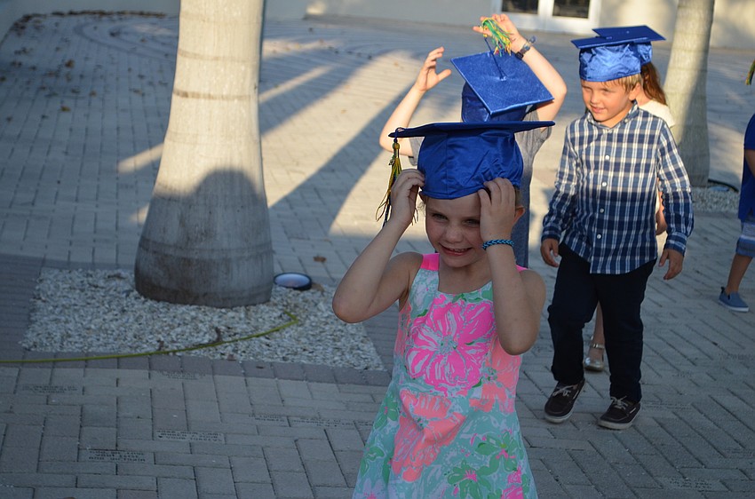 Crosby Arent adjusts her cap on the way to the chapel.
