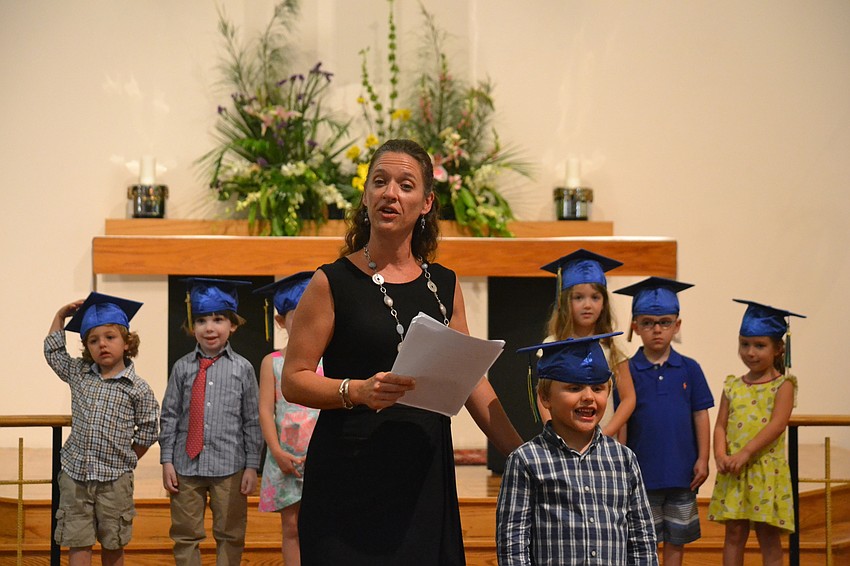 St. Boniface Preschool Director Sarah Schebel introduces graduate Austin Bobb.