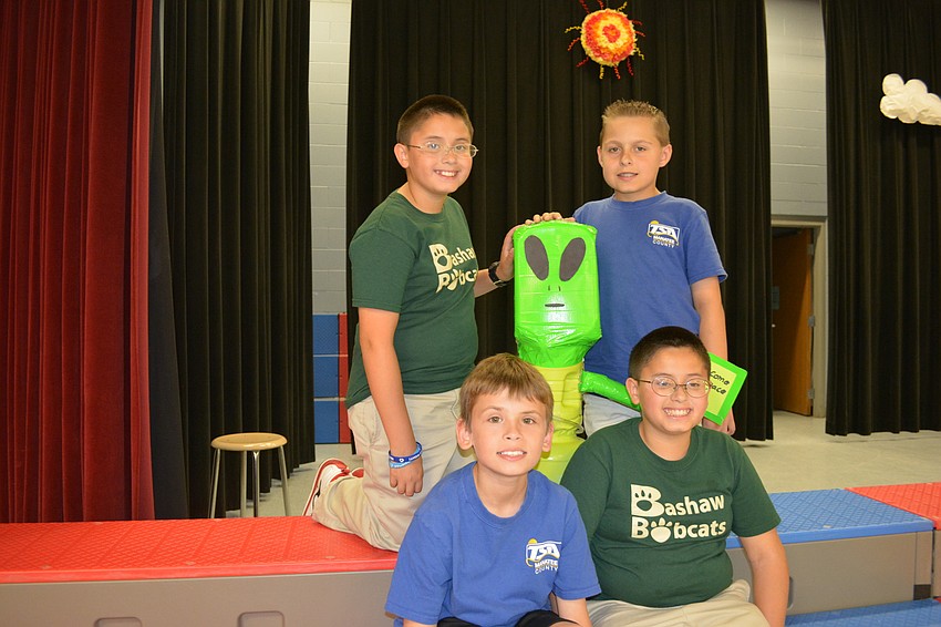 Bashaw fifth graders Nathan Alpert and Derek Jones, in back row, and Angelo Campanale and Garbiel Alpert entered their alien water tower.