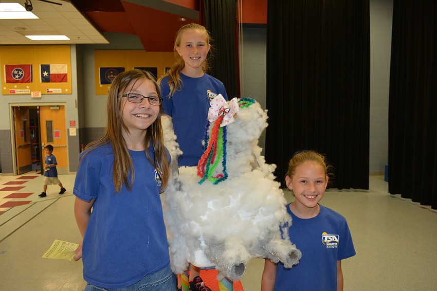 Audrey Roden, Sophia Stock and Ellie Barker of Braden River Elementary built a Pegasus water tower with fluff from pillows.