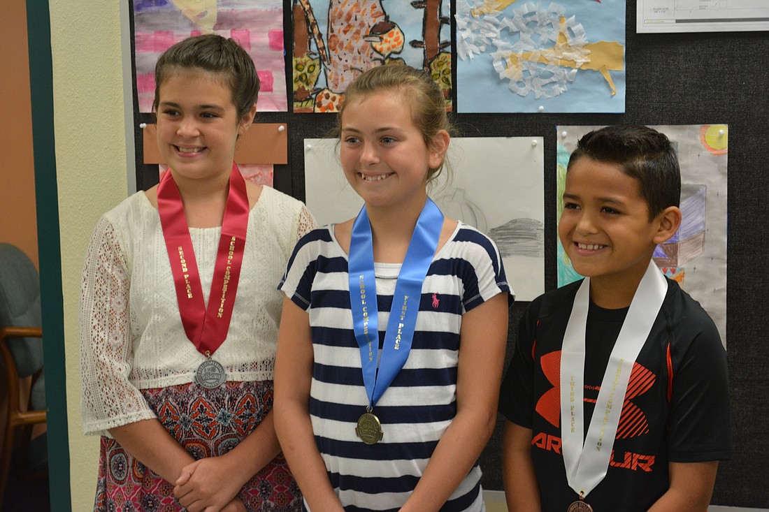 Declan Hudson, second, Eva Bouchard, first, and Jarom Su'a, third, were the top three in the Tropicana Speech Contest at Gene Witt Elementary.