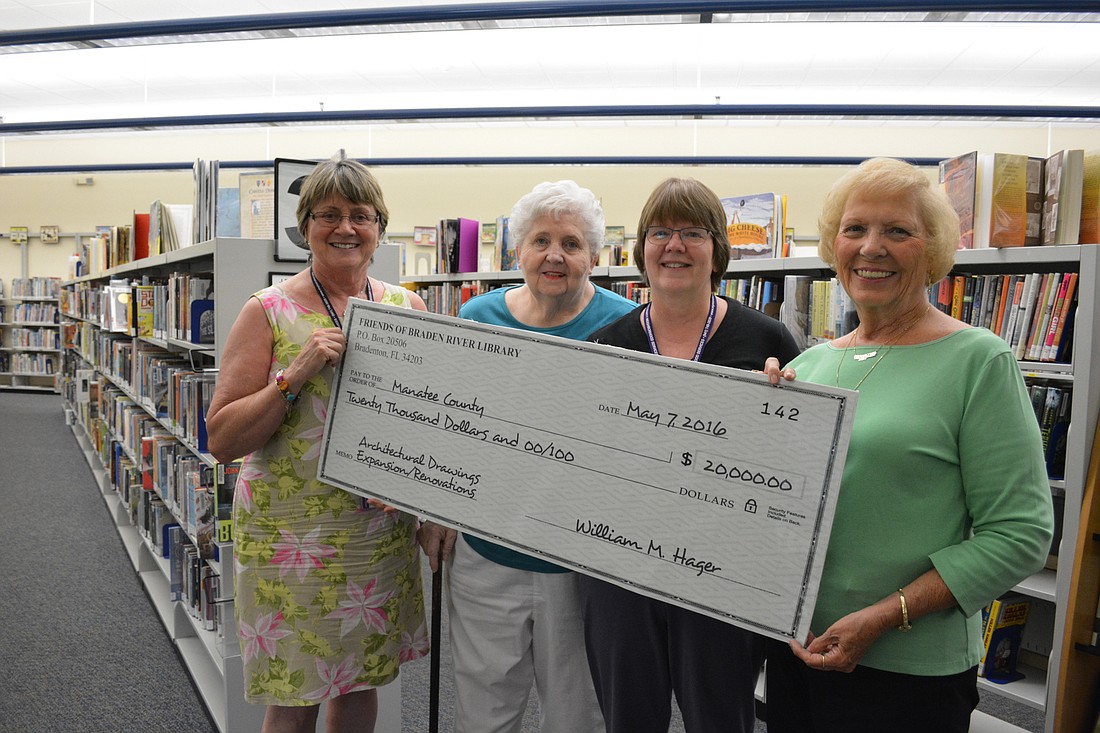 Assistant Branch Supervisor Judy Mullen, Friends of the Braden River Library President Martha Crabb, library Branch Supervisor Cathy Laird and Friends' Vice President Judy Harris show off the symbolic check.