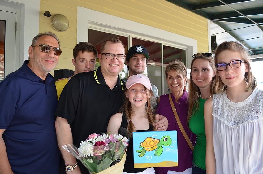 Turtle Inc. founder Lexi Mariash (center) surrounded by family members Jeff, Zachary, Brian, Anthony and Claire Mariash, Jill Anderson and Sydney Federici.