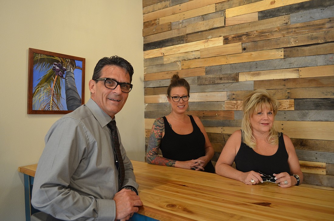 Bill Santamaria, Nicole Leffler and Jill Whittemore are three of the Gulf Gate Village business owners who want to foster a collaborative spirit among merchants within the district.