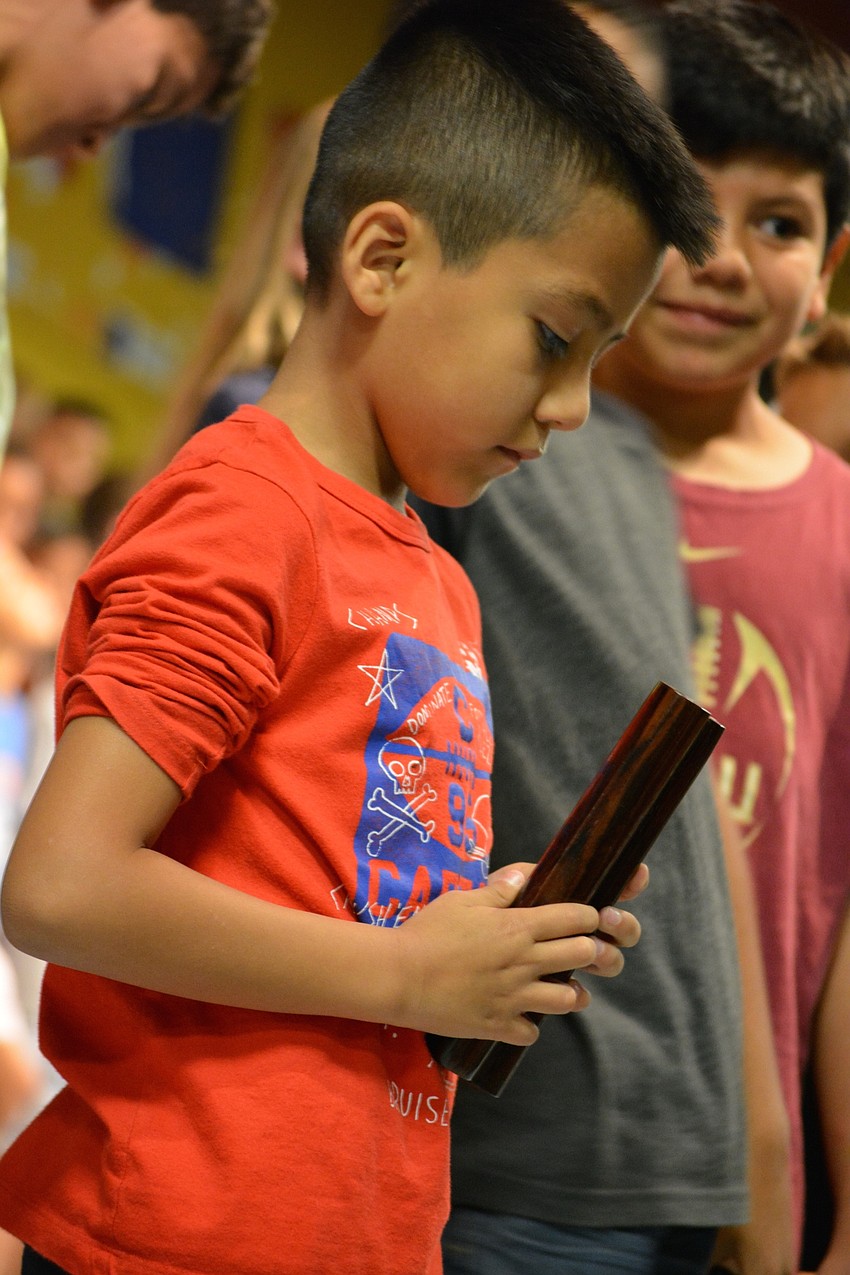 Angel Escamilla makes the sound of rain.