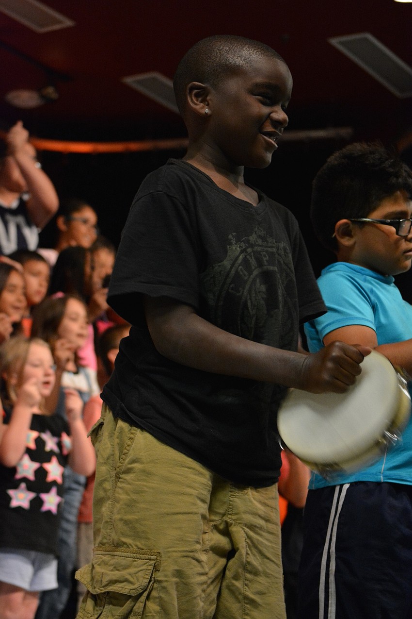 Zy Rice drums to make sounds of thunder and lightning.