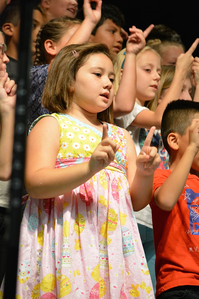 Sophia Mast signals how vapors rise.
